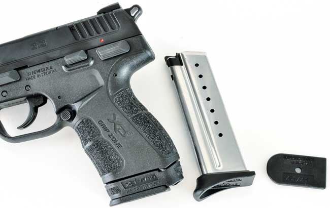  The XD-E comes with an extended nine-round magazine with grip extender (inserted) and an eight-round magazine with two different base pads: flush and extended.