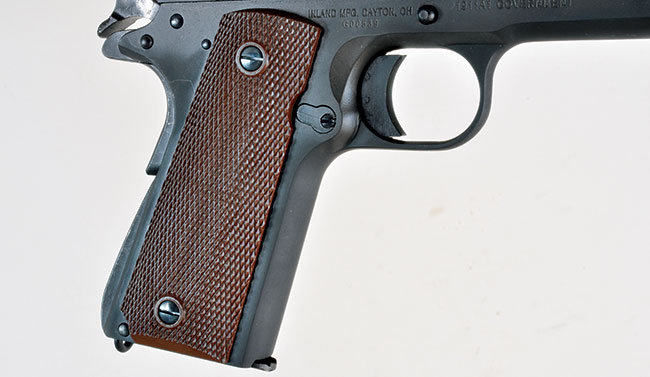 The 1911A1 features the original’s brown plastic grips, a short trigger and an arched mainspring housing. However, the Inland gun does employ a Series 80 firing pin safety.