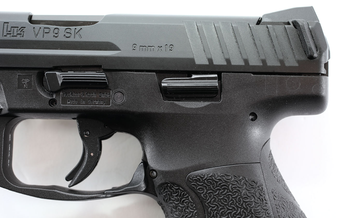 The pistol features an ambidextrous slide lock lever. The magazine release is an ambidextrous paddle at the bottom of the trigger guard. The trigger is crisp, with a short reset.