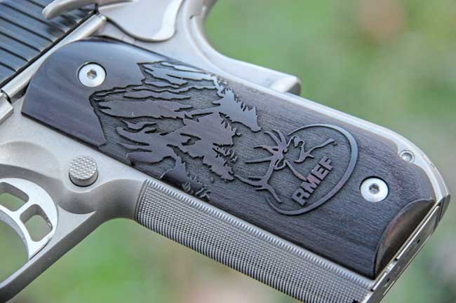 Grips are laser-engraved with a mountain scene and the RMEF logo. The frontstrap is checkered in a 30 lpi pattern to help maintain control of the pistol.