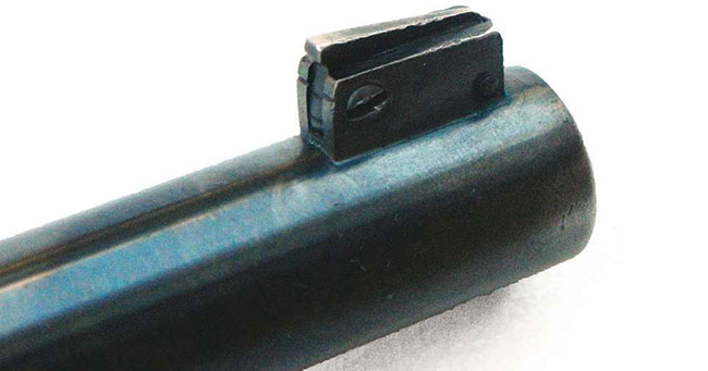The revolver’s front sight features a blade within a post. Loosening the screw permits the inner blade to be raised or lowered.